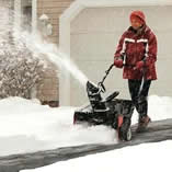single stage snow blower in action