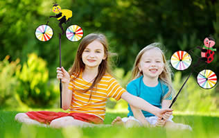 kids playing with Dreamline pinwheels